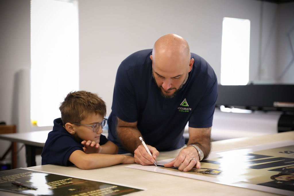 Accurate Color shop floor with the team working on a large-format print job