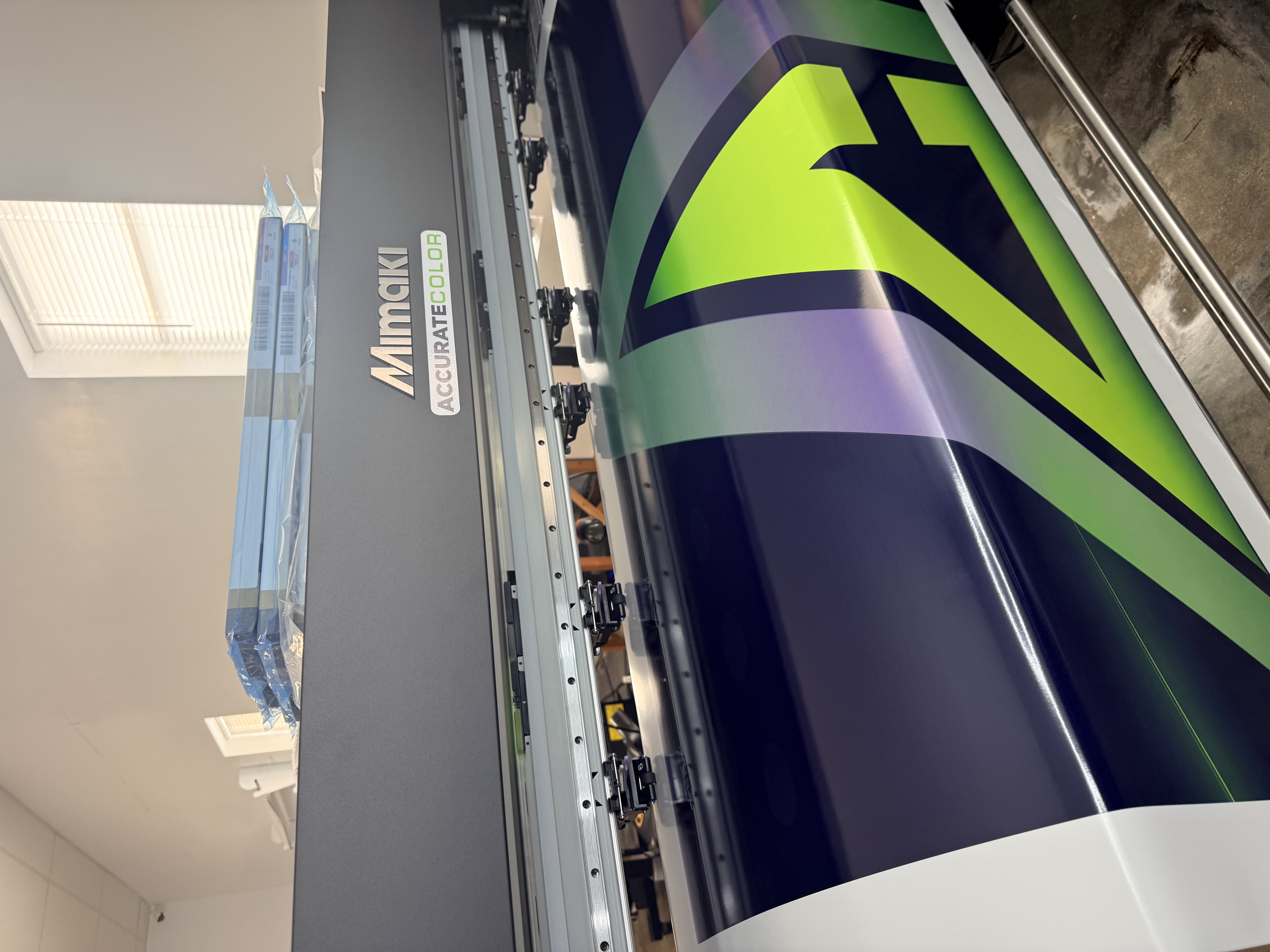 Accurate Color team installing a large-format printed sign