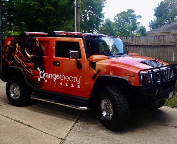 Van with a full-color custom vehicle wrap