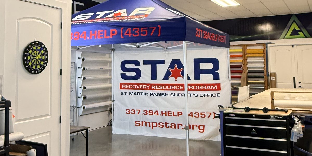 STAR Recovery Resource Program canopy tent with a full printed back wall